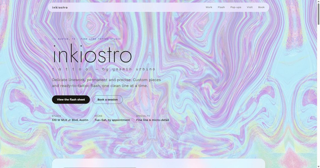 Screenshot of the live Inkiostro Tattoo website, showing its animated holographic hero section