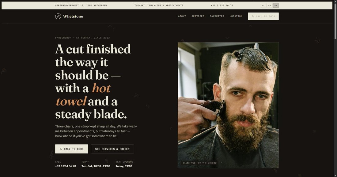 Screenshot of the live Whetstone Barbershop website, showing a barber giving a client a haircut